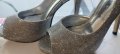 Елегантни дамски обувки на ток в сребърно 38 номер