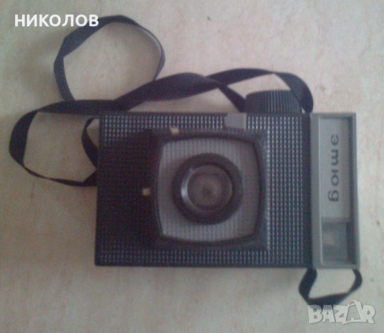 нов фото-апарат