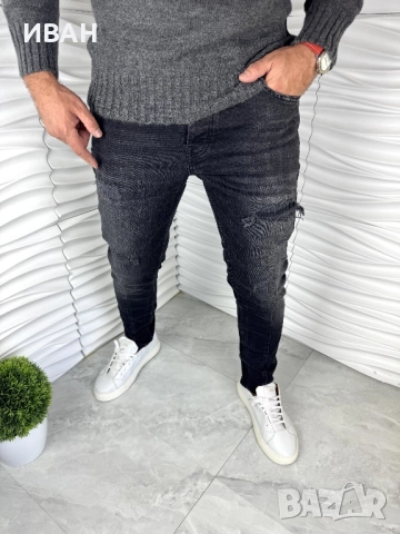 Мъжки дънки в черен цвят с кръпки и ръб