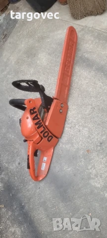 верижен трион резачка за дърва dolmar