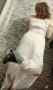 Елегантна къса  рокля с падащ ръкав, изработена от висококачествена дантела в бял цвят., снимка 1 - Рокли - 40257544