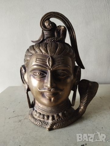 Стара статуетка -главата на бог Шива